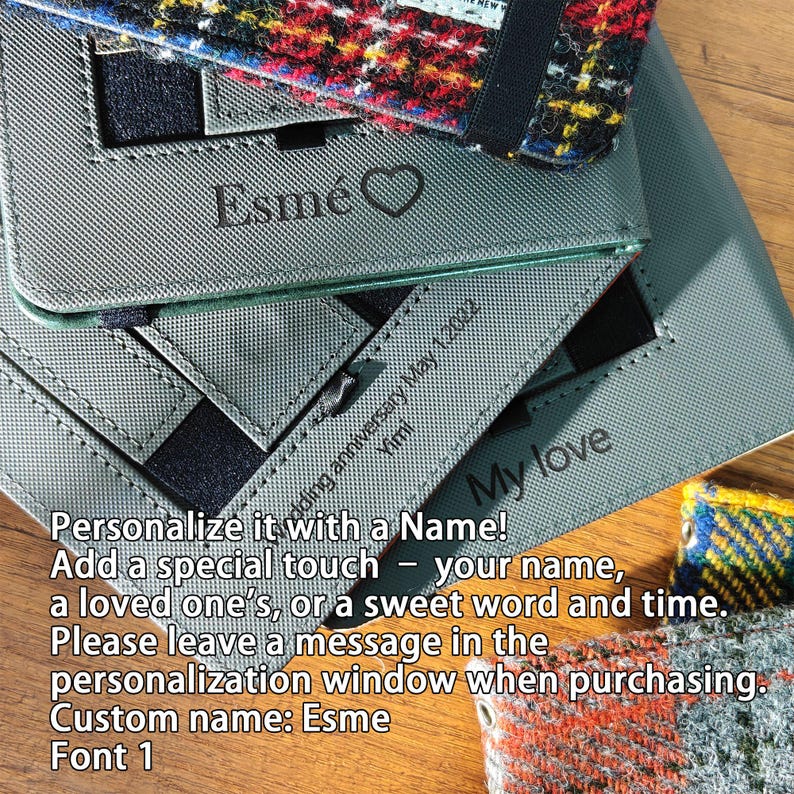 May include: Gray personalized notebook covers with the name "Esm&eacute;" and a heart symbol. The text "My love" and "Wedding anniversary May 1, 2022" are also visible. The covers are shown with a colorful plaid fabric.