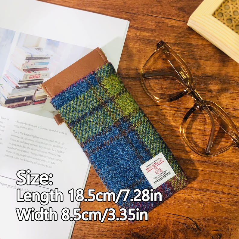 May include: A blue, green, and brown plaid glasses case with a brown leather top. The case is 7.28 inches long and 3.35 inches wide. The text on the case reads "Size: Length 18.5cm/7.28in Width 8.5cm/3.35in".