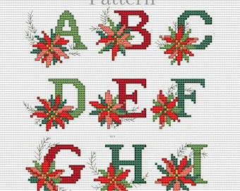 Puede incluir: Patrón de punto de cruz con las letras de la A a la I, cada una adornada con una flor de pascua y vegetación. Las letras alternan entre rojo y verde, con la palabra «Pattern» en la parte superior. El diseño está sobre un fondo de cuadrícula blanca.
