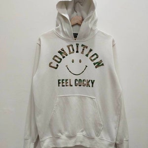 Harvey Ball Smiley Face Hoodie Pullover Jumper Sweatshirt Condition Feel Cocky Big SpellOut