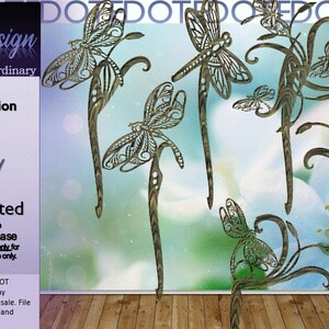 May include: A digital download of six laser-ready SVG files featuring dragonfly hair stick designs. The designs are intricate and detailed, with a delicate floral motif. The files are Glowforge tested and ready to be used for crafting and personal projects.