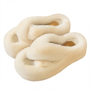 May include: A pair of cream-colored plush faux fur slippers featuring a thick platform sole and a crisscross strap design across the top. The interior footbed is lined with a smooth material and includes a small label with the text FASHION.