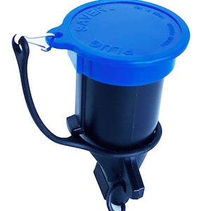 May include: A blue and black plastic plug saver with a loop for attaching to a key chain. The plug saver has the text "PLUG SAVER" on the blue cap and "MADE IN USA" on the side of the cap.