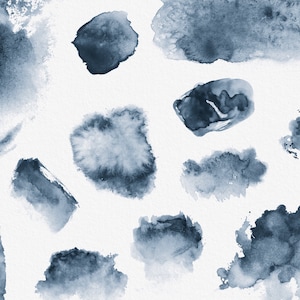 May include: A collection of abstract watercolor shapes in shades of blue. The shapes are irregular and organic, with soft edges and a textured appearance. The background is white.