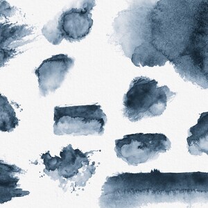 May include: A collection of 12 abstract watercolor shapes in shades of blue. The shapes are various sizes and are arranged in a random pattern on a white background.