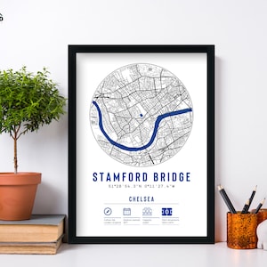 May include: A black framed print with a white background featuring a map of Stamford Bridge, the home of Chelsea Football Club. The map is in a circle with the coordinates 51&deg;28'54.3"N 0&deg;11'27.6"W and the text "Stamford Bridge, Chelsea" below the map. The print also includes icons for the stadium's location, capacity, and opening date.
