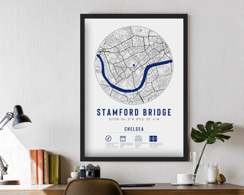 May include: A black and white map print of Stamford Bridge, a football stadium in Chelsea, London, England. The map shows the stadium's location and surrounding streets. The print includes the stadium's name, coordinates, and capacity.