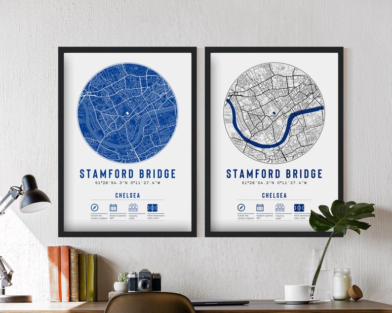 May include: Two framed prints of a map of Stamford Bridge, London, England. The map is in a circle with the name of the location and coordinates below. The left print has a blue map with a white background, and the right print has a black map with a white background.