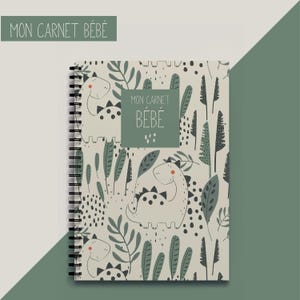 May include: A spiral-bound notebook with a cover featuring a whimsical dinosaur and foliage pattern in shades of green and beige. The text "MON CARNET BÉBÉ" is displayed on the cover. The notebook is designed for baby-related notes.