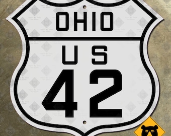 May include: White and black US Route 42 highway sign with the text "OHIO" and "US 42" in black lettering. The sign is shaped like a shield with rounded edges.