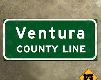 May include: Green and white rectangular sign with the text "Ventura County Line" in white letters.