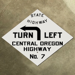 Central Oregon Highway DRAAI LINKS route 7 verkeersbord diamant pijl 1910 US 20