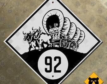 Nebraska route 92 highway marker road sign shield 1927 Conestoga wagon oxen