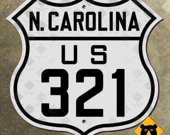 May include: White and black US highway sign with the text "N. CAROLINA US 321" on a white background.