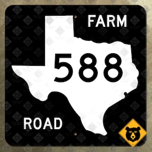 May include: Black and white Texas road sign with the text "FARM ROAD 588" and a black bear silhouette in a yellow diamond warning sign.