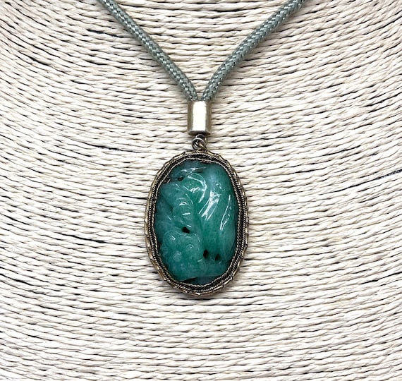 Hand carved jade pendant deals