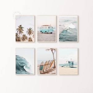 May include: Six framed prints with a beach theme. The prints depict palm trees, a vintage blue van with a surfboard, surfers riding waves, a large ocean wave, surfboards on the beach, and a lifeguard station.