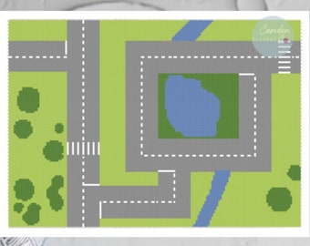 May include: A crochet pattern for a playmat featuring a road with a pond and trees. The pattern is available as a PDF download.