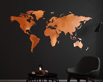 May include: A copper-colored world map wall decor with a black armchair and a black side table with a book and candles on top. The wall is painted black.