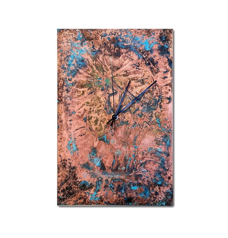 May include: A square copper clock with a blue and green patina. The clock face has black hands and a black center.