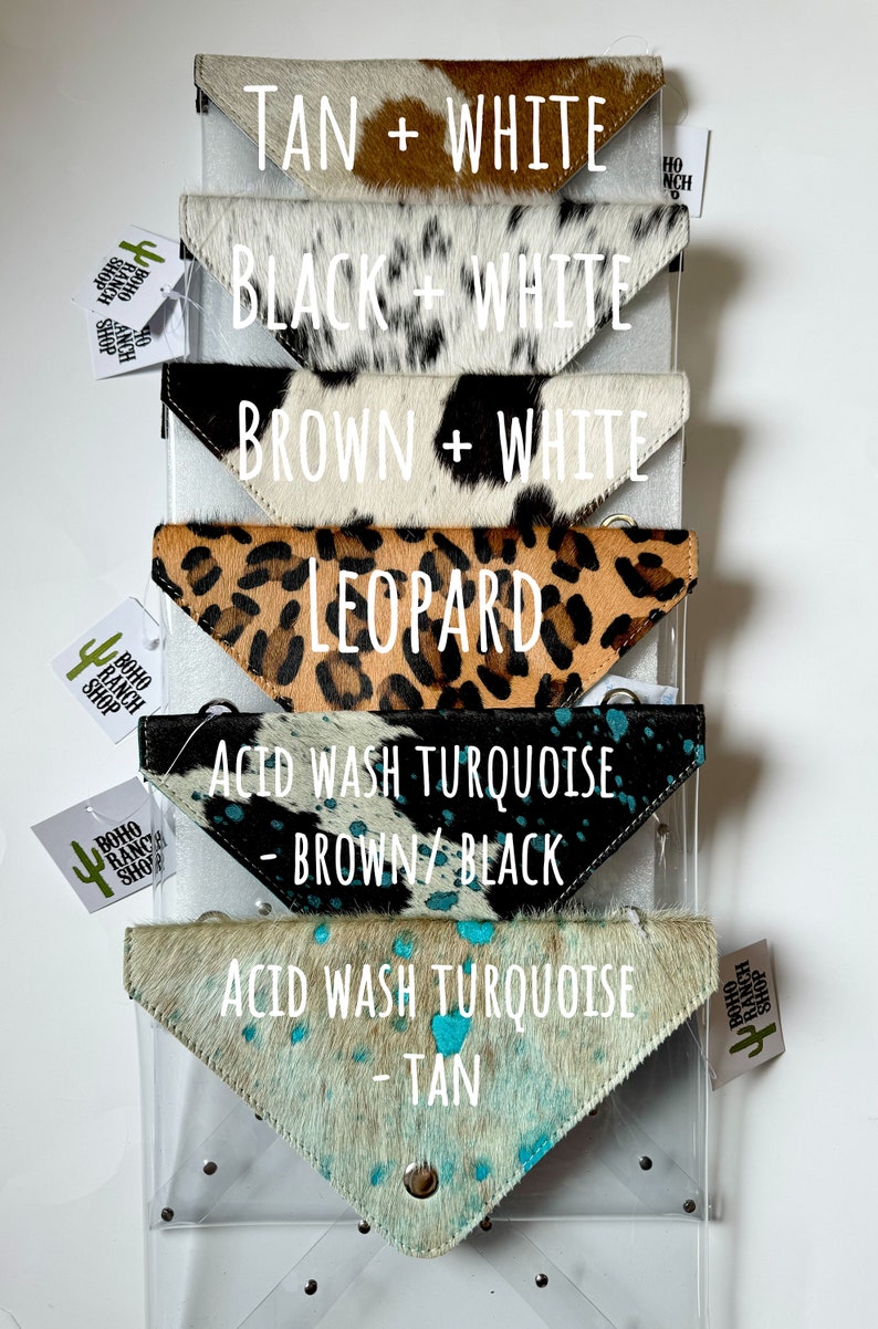 May include: Six triangular cowhide pouches arranged vertically. Patterns include tan and white, black and white, brown and white, leopard print, acid wash turquoise with brown and black, and acid wash turquoise with tan. Each has a metal snap closure.
