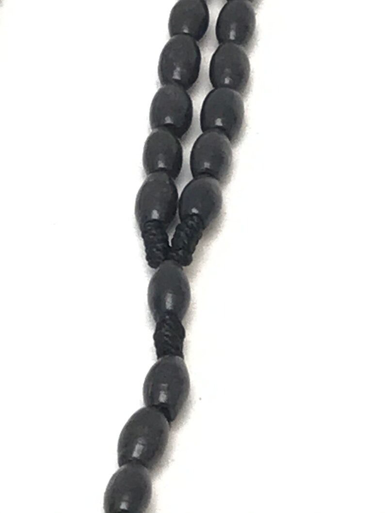 Beautiful black wood stones with Jesus charm rosary style necklace