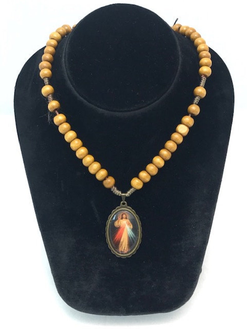 Heart of Jesus charm with light brown wood beads and screw closer necklace