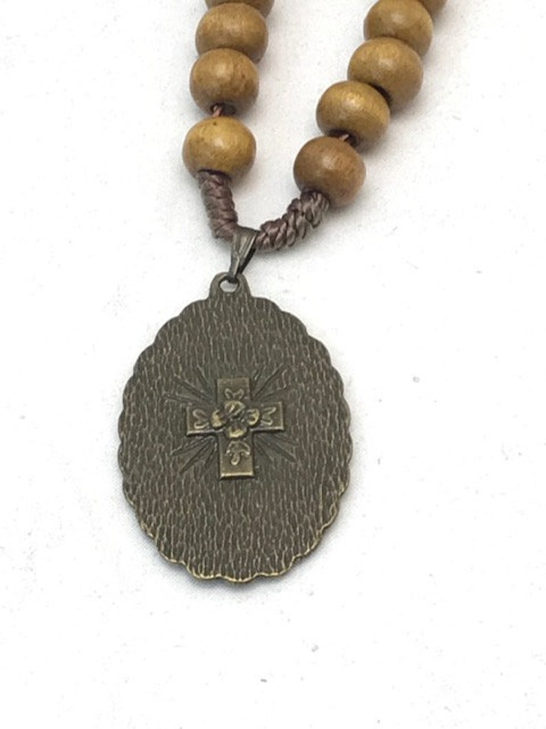 Heart of Jesus charm with light brown wood beads and screw closer necklace