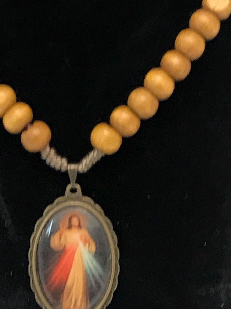 Heart of Jesus charm with light brown wood beads and screw closer necklace