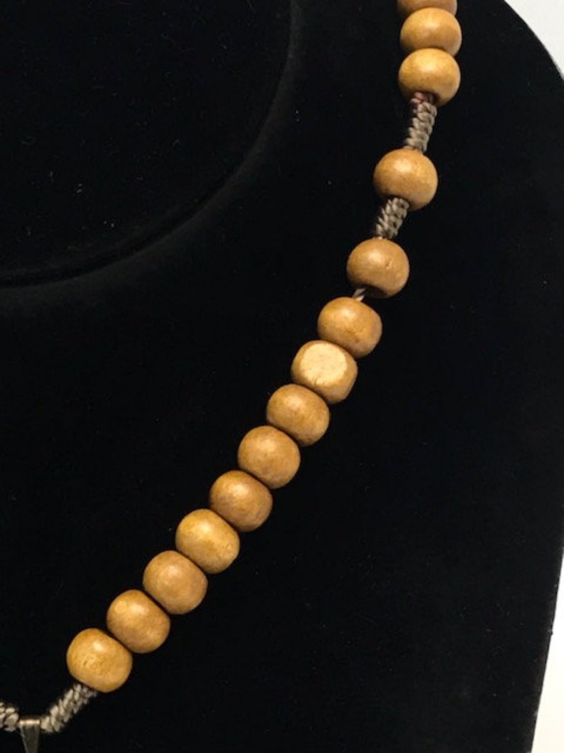 Heart of Jesus charm with light brown wood beads and screw closer necklace