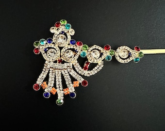 Exquisita flauta de latón con pedrería y piedras preciosas. Disponible en 5 tamaños.