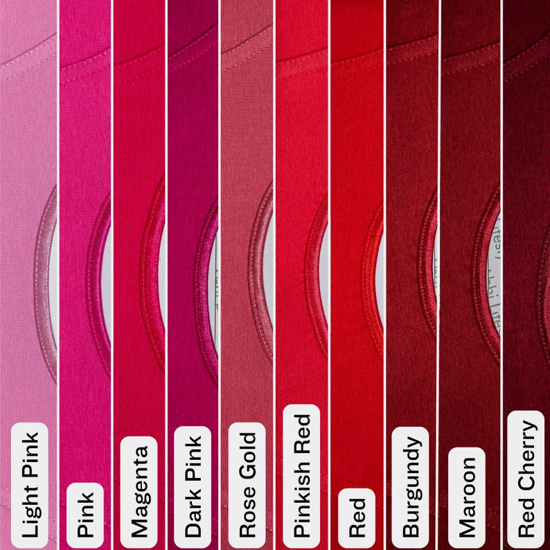 May include: A color palette of nine different shades of pink and red t-shirts. The colors range from light pink to deep red cherry, with labels identifying each shade. The t-shirts have a crew neck design.
