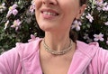 Handmade Tulsi Bead Necklace: Radha Carved Krishna Jewelry product logo