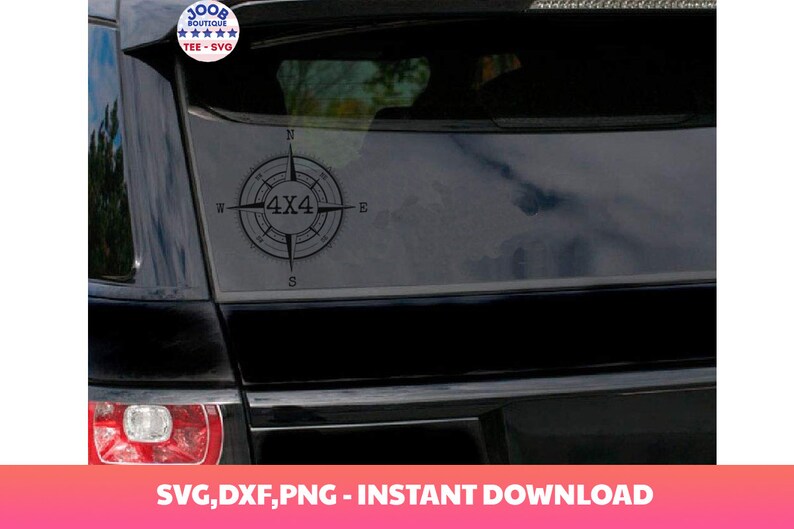 May include: A black car with a compass sticker on the back window. The compass has a 4x4 design in the center.