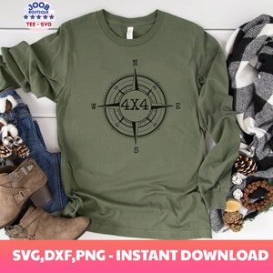 May include: A green long-sleeved shirt with a black compass design featuring the text "4X4" in the center. The compass points are labeled N, S, E, and W.