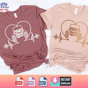 May include: Two t-shirts with a heart and a jeep inside the heart with a heartbeat line underneath. The t-shirt on the left is maroon and the t-shirt on the right is light pink.