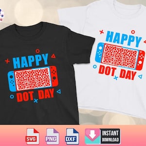 May include: Two t-shirts, one black and one white, each with a colorful graphic. The design features a game controller with a red dot pattern and the text "HAPPY DOT DAY" in blue and red. The shirts are casual wear.