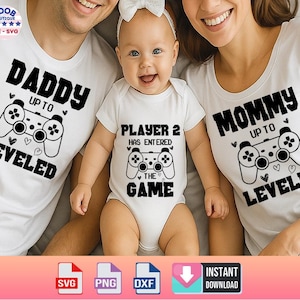 May include: Matching family shirts and baby bodysuit with a gaming theme. The white shirts and bodysuit feature black text and a controller graphic. The shirts say "Daddy Up To Leveled" and "Mommy Up To Leveled". The bodysuit says "Player 2 Has Entered The Game".