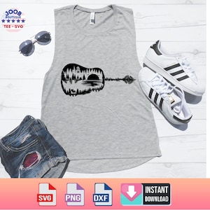 May include: A gray tank top with a black guitar graphic featuring a forest and lake scene. The image also includes white sneakers with black stripes, sunglasses, and denim shorts. The top has a scoop neck.