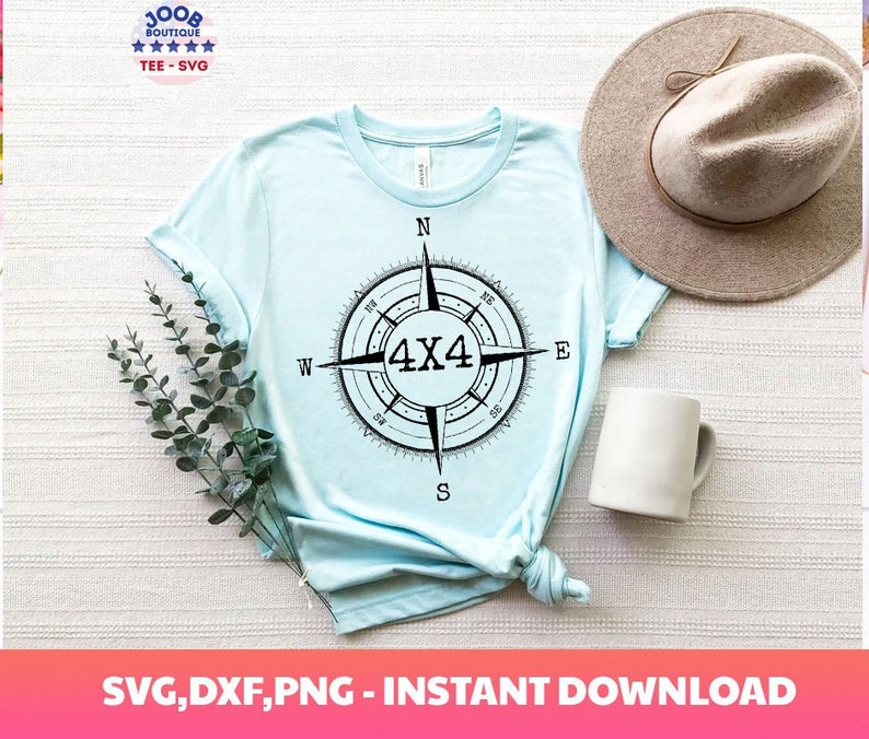 May include: A light blue t-shirt with a black and white compass design featuring the text "4x4" in the center. The compass is surrounded by the cardinal directions: N, S, E, W.