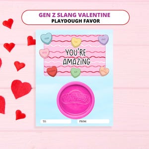 May include: A Valentine's Day card with a pink and blue background, featuring a Play-Doh container and heart-shaped candies with slang terms. The card reads "You're Amazing" and includes the text "Gen Z Slang Valentine Playdough Favor".