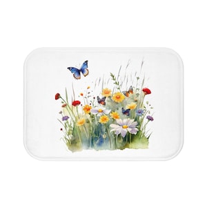 Könnte beinhalten: Ein Aquarellbild eines Feldes mit Wildblumen und Schmetterlingen. Die Blumen sind in den Farben Gelb, Rot, Rosa und Weiß gehalten. Die Schmetterlinge sind blau, orange und schwarz.