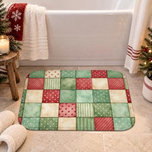 May include: A rectangular bath mat featuring a patchwork design of squares in shades of red, green, and cream. The pattern includes various motifs such as polka dots, thin stripes, and small crosses, creating a festive, multi-colored grid layout.