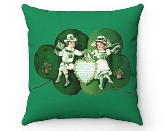 May include: A green shamrock pillow with a vintage illustration of two children in green and white clothing holding hands. The text on the pillow reads "The month is March, the day Seventeen,  Get's up and dance on from Green All on Patrick's Day."