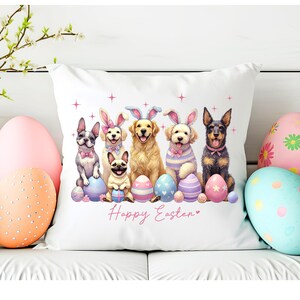May include: White pillow with a colorful illustration of five dogs wearing bunny ears and holding Easter eggs. The text "Happy Easter" is printed below the dogs.