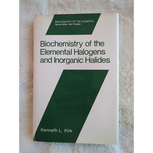 May include: A hardcover book titled "Biochemistry of the Elemental Halogens and Inorganic Halides" by Kenneth L. Kirk. The cover is white with green diagonal and rectangular accents. The text "BIOCHEMISTRY OF THE ELEMENTS" is at the top.