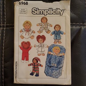 May include: Simplicity sewing pattern number 6968 for making doll clothes. The pattern includes instructions for making a dress, pajamas, a robe, a sleeping bag, and a nightgown. The pattern is for one size.