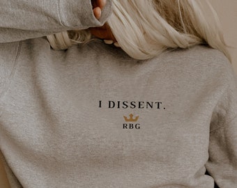 May include: A gray sweatshirt with the text "I DISSENT. RBG" and a crown graphic.