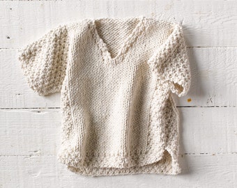 One of a kind; hand knit baby sweater using soft rag cotton yarn. Size 12-18 months.