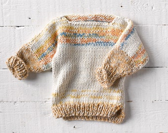 One of a kind; hand knit baby sweater in size 0-6 months. I used multiple yarns to create this beautiful sunset colors in this unique piece.